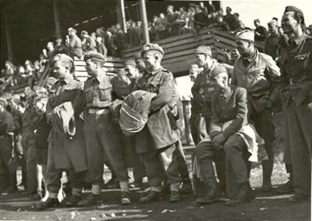 Soliders from Great Britan and Partisans in Maribor(Slovenia) watching together a friendly soccer game